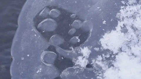 Water running under ice Stockbeeldmateriaal 87339740