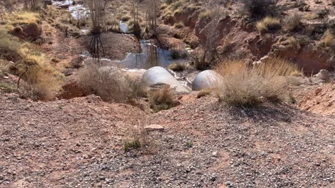 Water runoff from a concrete pipe Video stock 170783874