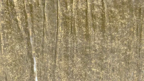 The water runs down the smooth stone surface to form an even texture. Stock Footage 241210256