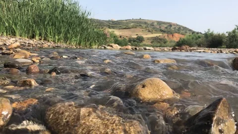 The water runs in the river Stock Footage