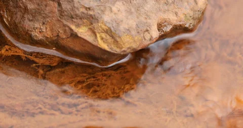 Water Runs on a Stone 스톡 동영상 335670424