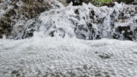 Water Rush Reversal: Close-Up of Waterfall Flow in Reverse Motion Stock Footage 303975869