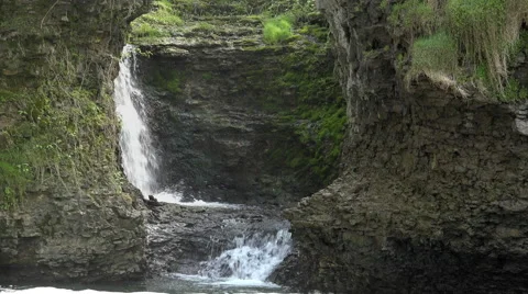 Water rushing down falls in cave 4k Video stock 55475601