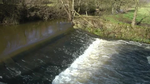 Water rushing over dam weir mill race for Cheddleton Flint Mill Stock Footage 47403360