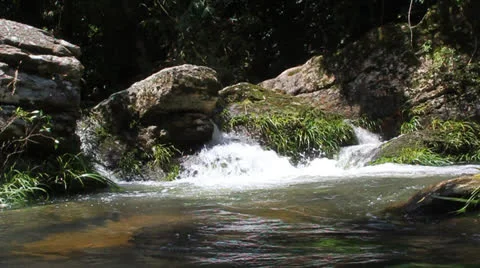 Water rushing over rocks Video stock 22606691