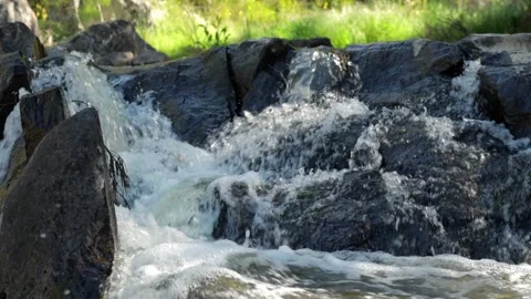 Water rushing over rocks Video stock 163798797