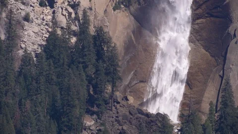 Water rushing over stone cliff in spring Bridalveil Fall Yosemite Valley Video stock 99087993