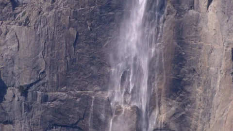Water rushing over stone cliff in spring Bridalveil Fall Yosemite Valley Stock Footage 99088262