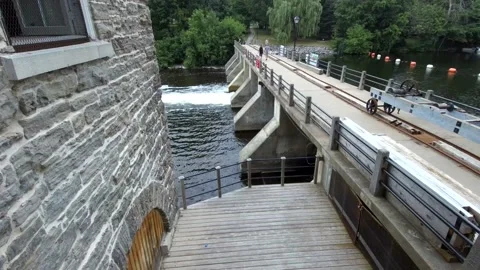 Water rushing through a dam Stock Footage 135770030