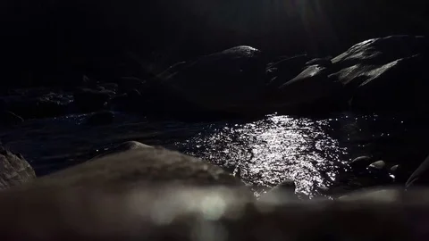 Water rushing through rocks in a river (dark color graded version) Stock Footage 74062935