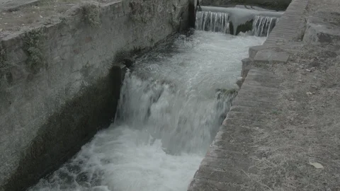 Water rushing through a small lock Stock Footage 86749190
