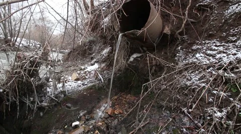 Water from rusty pipe pollute city river Stock Footage 59947459
