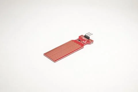 A water sensor or red rain sensor is used as a DIY material for electronics h Stock Photos