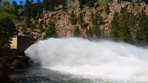 Water shoots from the Button Rock Dam Floodgate west of Longmont, Colorado Stock Footage 111848988