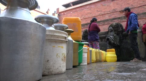 Water shortage buckets jerrycans queue fountain Kathmandu Nepal Asia Stock Footage 48783104