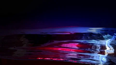 Water side in slow motion, Dark Liquid Surface Wave close up on black Stock Footage 95533771