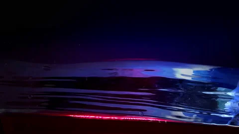 Water side in slow motion, Dark Liquid Surface Wave close up on black. Video stock 95533793