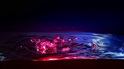 Water side in slow motion, Dark Liquid Surface Wave close up on black. Stock Footage 95533902