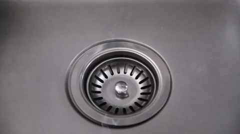 Water in a sink running down the drain Stock Footage 52459065