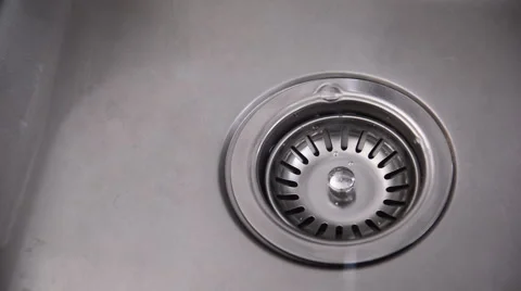 Water in a sink running down the drain, weak stream of water Stock-Footage 52459161