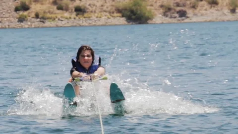 Water Skier Getting Pulled Up Stock Footage 111857200