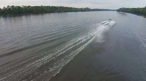 Water Skiier passing below camera and moving away Stock Footage 54115032