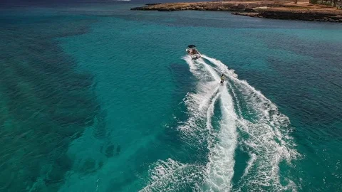 Water skiing at sea Stock Footage 117990775