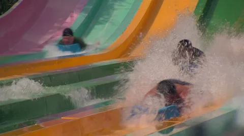Water Slide Action Close-up with People Splashing Video stock 24678301