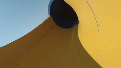 Water slide. Multi-colored pipe. Male legs. Stock-Footage 120031957