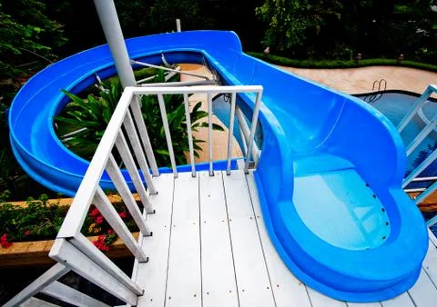 The water slide of pool in the forest Stock Photos