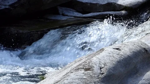 Water slow-motion shot of a stream forming waves and swirls 動画素材 114178266