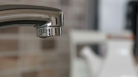 Water slowly dripping from the faucet Stock Footage