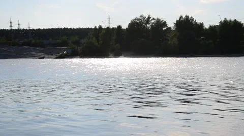 Water with small waves and far bank Stock Footage 53574484