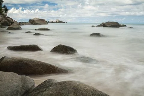 Water as soft as cotton between hard rocks Stock Photos