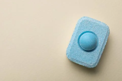 Water softener tablet on beige background, top view. Space for text 写真素材