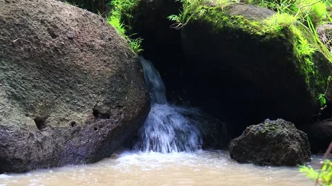 The water source from the rocks, flowing fast Stock Footage 234748827