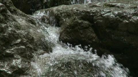 Water spilling over Rocks Stock-Footage 602992