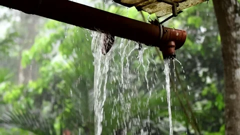 Water spillover from drain pipe during heavy rain. Rain water overflow. Stock Footage 253475151
