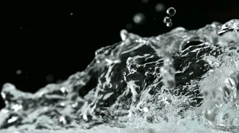 Water splash and ice cube, Slow Motion Stock Footage 12553896