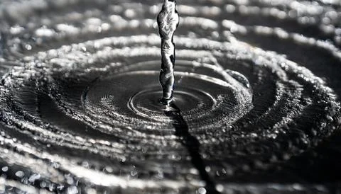 Water splash on black background. Drop pattern. Drop splash motion. Droplet Stock Photos