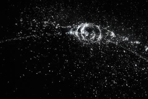 Water splash in black Stock-Fotos