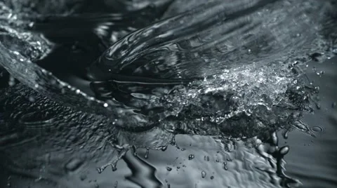 Water splash on black surface, Slow Motion Stock Footage 12159613