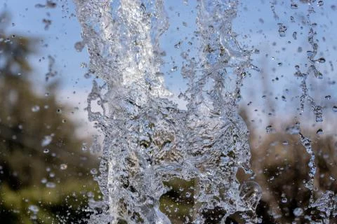 Water splash on blurred background Stock Photos