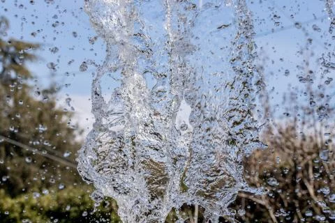 Water splash on blurred background Stock Photos