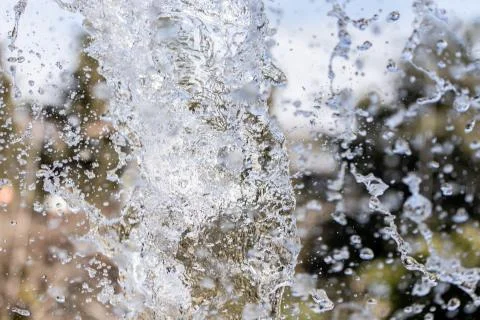 Water splash on blurred background Stock Photos