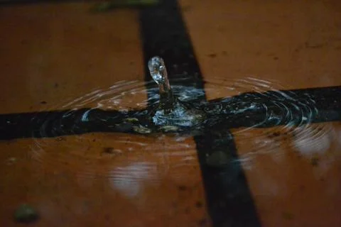 Water Splash on Brick Puddle Foto stock