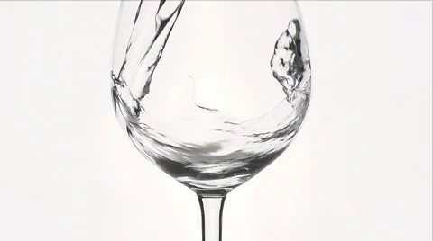 Water splash is falling into a wineglass Vídeo Stock 58770805