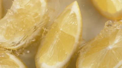 Water splash on fresh cut lemons. Slow Motion. Stock Footage 121491201