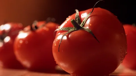 Water splash on fresh tomatoes on table. Slow Motion. Video stock 121479463