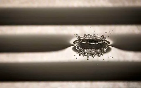 Water splash on gray background Stock Photos